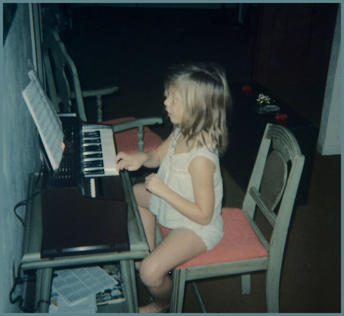 Little Cilla playing piano